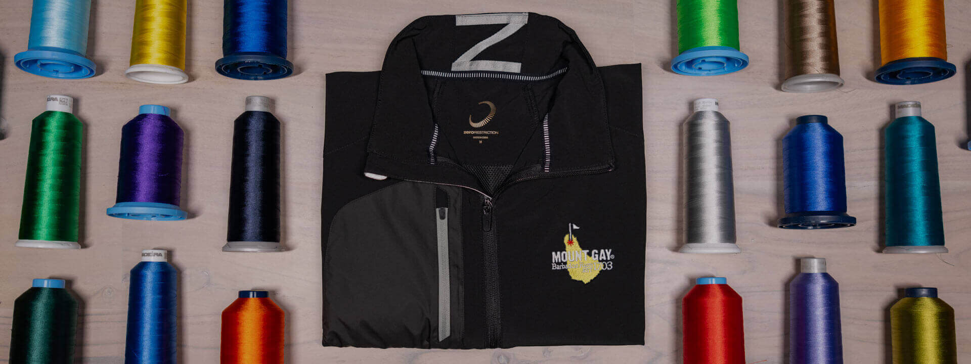 Zero Restriction Golf. Embroidered Jackets. Custom Golf Hats. Custom Vest. Custom Quarter Zips.
