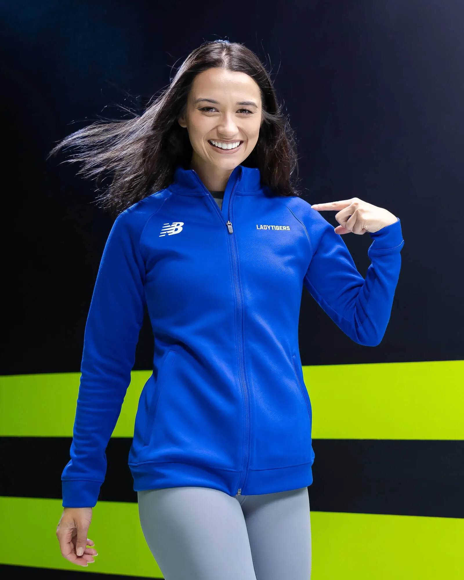 Athletes wearing New Balance custom sports team apparel