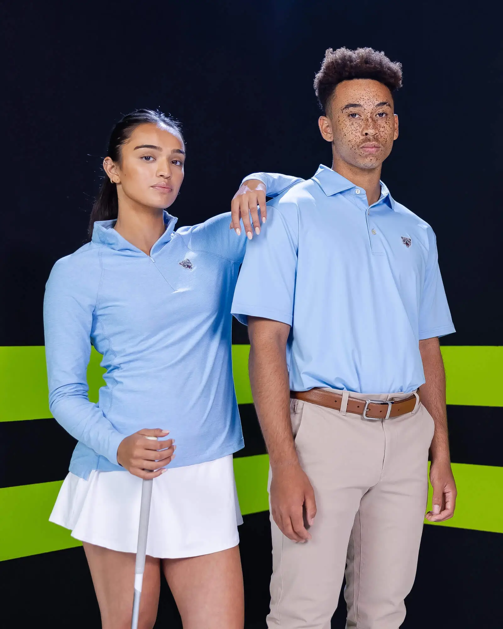 Coach wearing Peter Millar team apparel with embroidered school logo