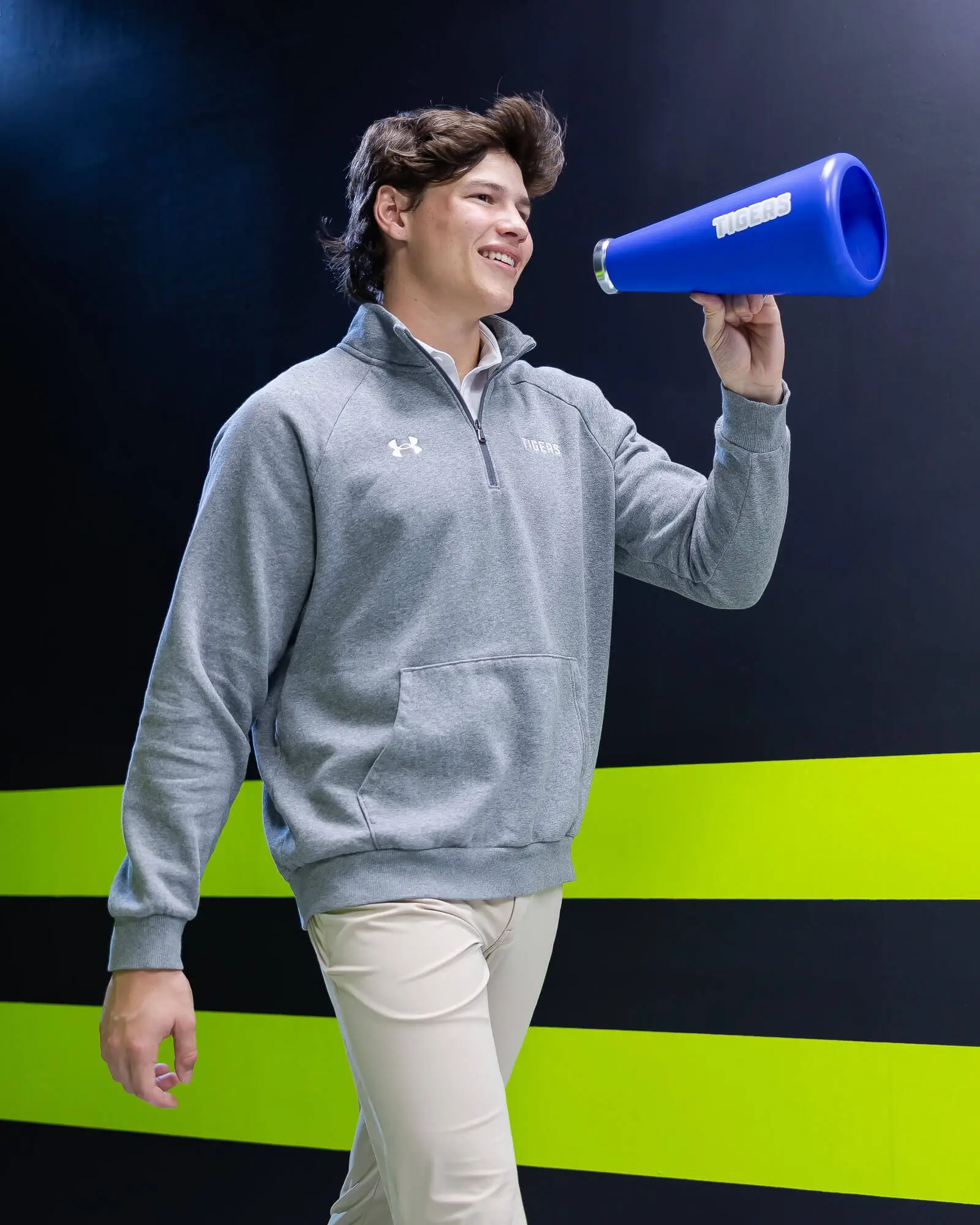 Athletes wearing Under Armour custom athletic apparel with team logo